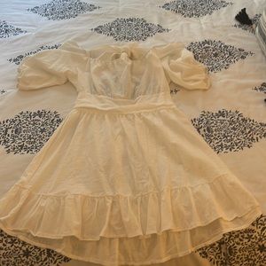 white puff sleeve tie back mini dress